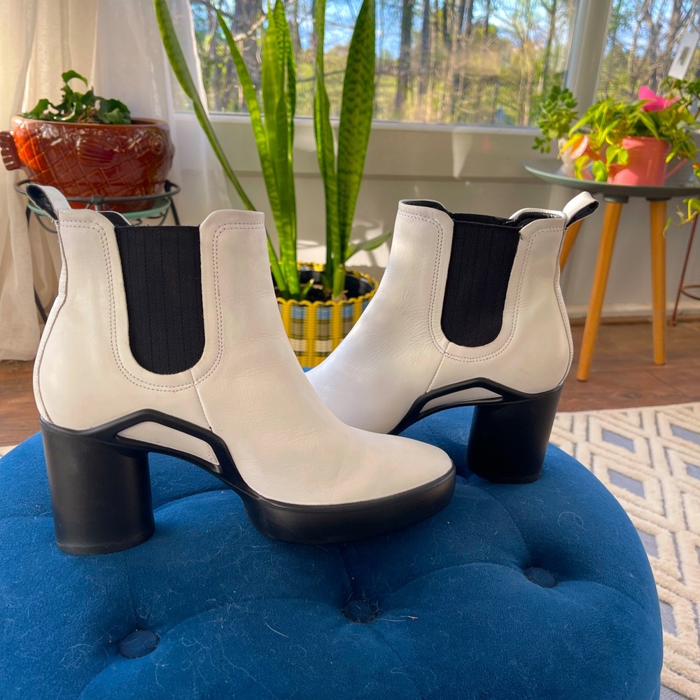 White boots with round black heel. Waterproof!